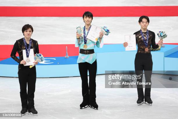 Shoma Uno , Yuzuru Hanyu and Yuma Kagiyama of Japan pose with medals during day four of the 90th All Japan Figure Skating Championships at Saitama...