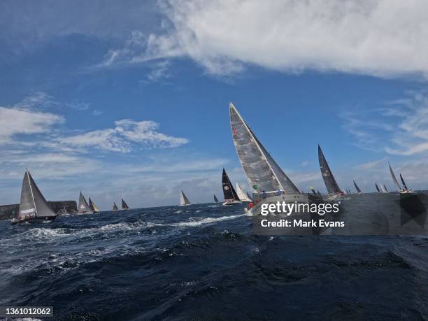 Yachts sail out of the Heads during the 2021 Sydney to Hobart race start on Sydney Harbour on December 26, 2021 in Sydney, Australia.