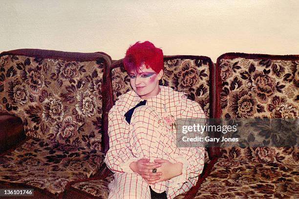 young woman wearing white and red plaid jumpsuit - fashion archive stockfoto's en -beelden