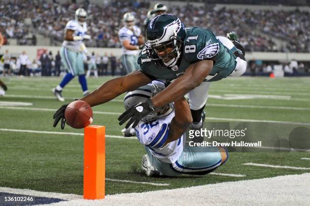 Jason Avant of the Philadelphia Eagles fumbles diving for the end zone over Orlando Scandrick of the Dallas Cowboys at Cowboys Stadium on December...