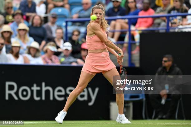 Italy's Camila Giorgi returns the ball to Russia's Daria Kasatkina during their women's singles semi-final tennis match at the Rothesay Eastbourne...