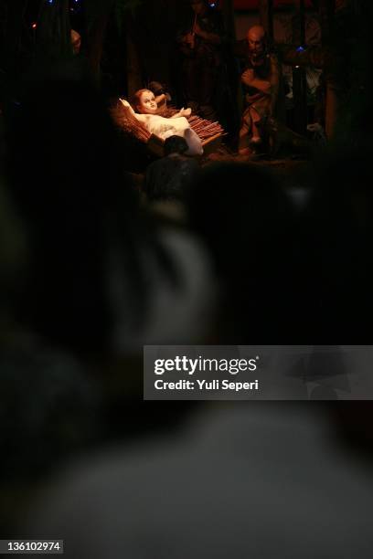Baby Jesus figure is displayed on Christmas day at Raja Agung Kristus Church on December 25, 2011 in Bintan Island, Indonesia. Christmas is a...