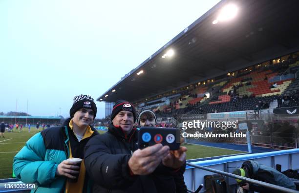 Father takes a picture with his sons ahead of the Gallagher Premiership Rugby match between Saracens and Worcester Warriors at StoneX Stadium on...