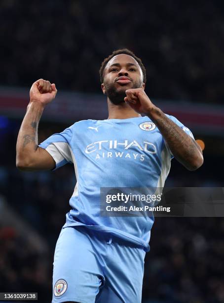Raheem Sterling of Manchester City celebrates after scoring their side's fourth goal during the Premier League match between Manchester City and...