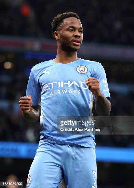 Raheem Sterling of Manchester City celebrates after scoring their side's fourth goal during the Premier League match between Manchester City and...