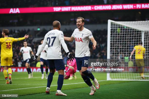 Harry Kane celebrates with teammate Lucas Moura of Tottenham Hotspur after scoring their team's first goal during the Premier League match between...