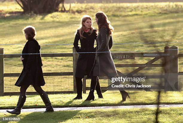 Catherine, Duchess of Cambridge and Princess Beatrice walk from Sandringham Church after an early Christmas Day service at Sandringham on December...