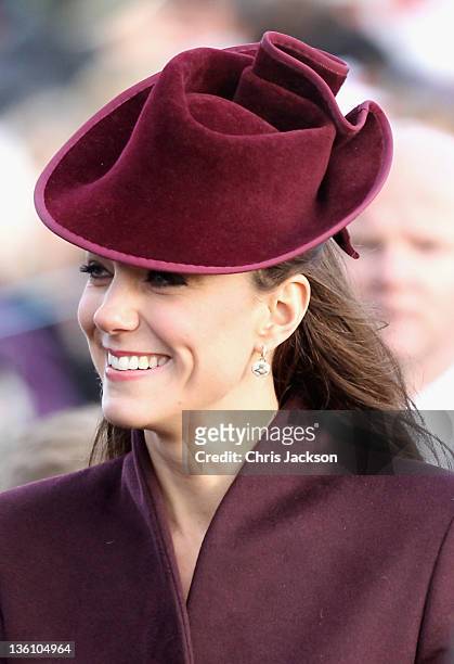 Catherine, Duchess of Cambridge walks to Sandringham Church for the traditional Christmas Day service at Sandringham on December 25, 2011 in King's...