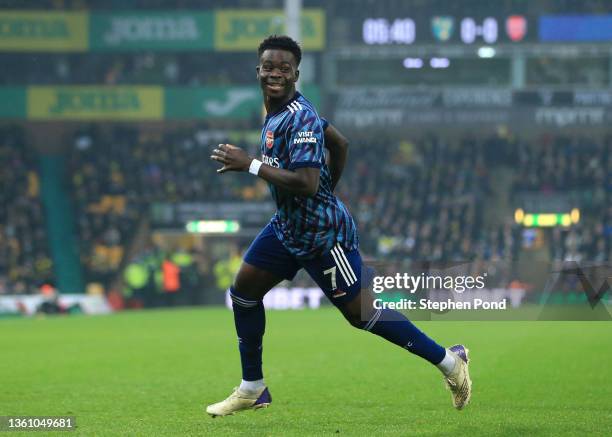 Bukayo Saka of Arsenal celebrates after scoring their team's first goal during the Premier League match between Norwich City and Arsenal at Carrow...