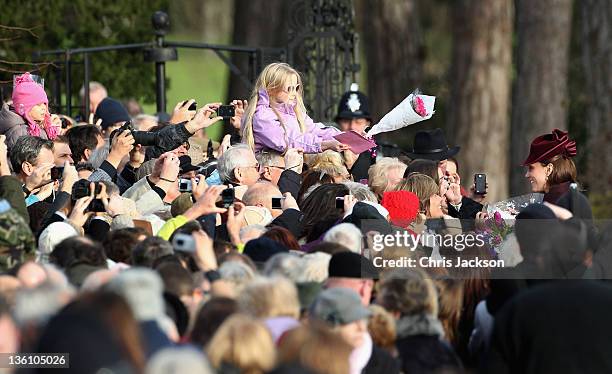 Catherine, Duchess of Cambridge meets members of the public as she leaves Sandringham Church after the traditional Christmas Day service at...