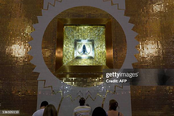 The image of Our Lady Aparecida seen during the Christmas Eve mass at her shrine, in Aparecida, 170 km northeast of Sao Paulo, Brazil on December 24,...