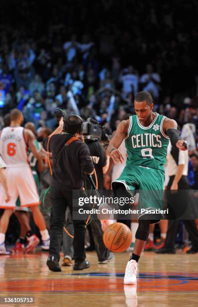 Rajon Rondo of the Boston Celtics kicks the basketball after losing to the New York Knicks at Madison Square Garden on December 25, 2011 in New York...