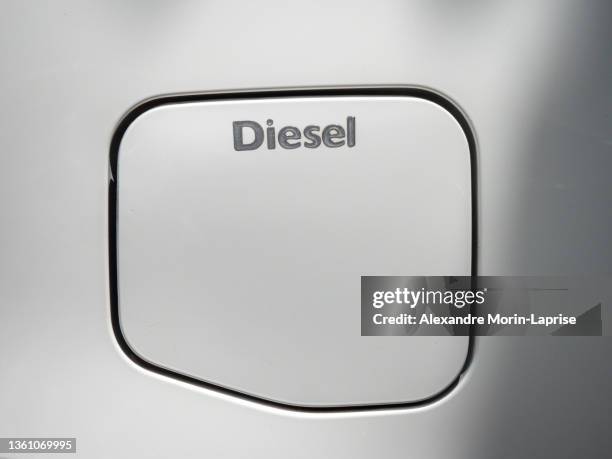 bright grey diesel fuel tank door of a clean modern car - covered car photos et images de collection