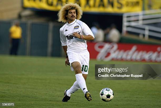 Carlos Valderrama of the Colorado Rapids passes upfield against the Los Angeles Galaxy during the first half on August 17, 2002 at the Rose Bowl in...