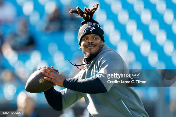 Cam Newton of the Carolina Panthers warms up before the game against the Tampa Bay Buccaneers at Bank of America Stadium on December 26, 2021 in...
