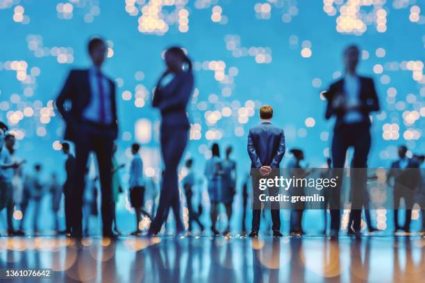 abstract businessman standing in vr environment - standing out from the crowd network stock pictures, royalty-free photos & images