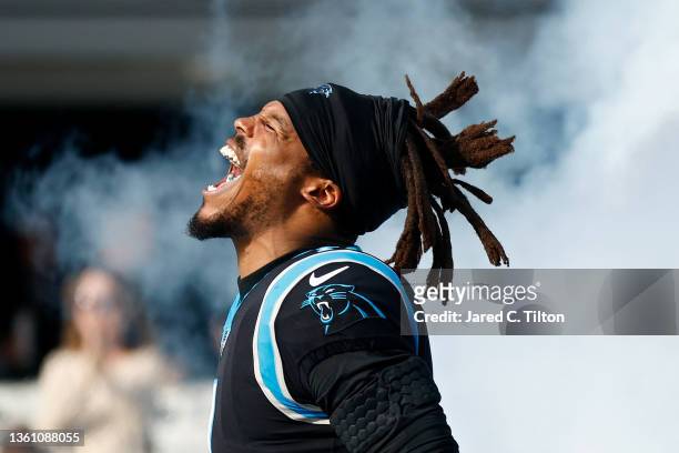 Cam Newton of the Carolina Panthers runs onto the field during the player introductions before the game against the Tampa Bay Buccaneers at Bank of...
