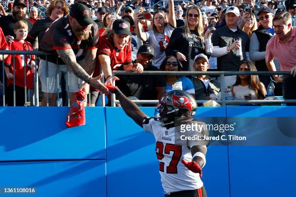 Ronald Jones of the Tampa Bay Buccaneers celebrates a touchdown with fans during the third quarter in the game against the Carolina Panthers at Bank...