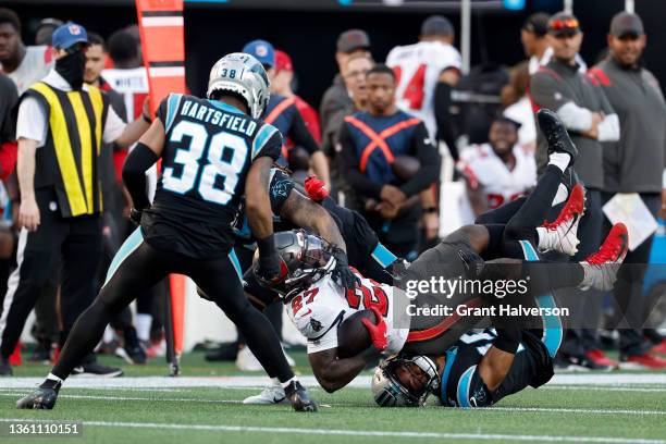 Henderson of the Carolina Panthers tackles Ronald Jones of the Tampa Bay Buccaneers during the fourth quarter at Bank of America Stadium on December...