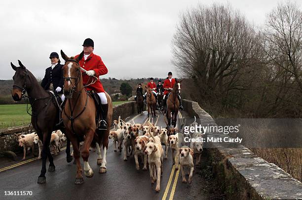 Jonathon Seed, Joint Master and Huntsman with the Avon Vale Hunt, leads the hounds and fellow riders for their traditional Boxing Day hunt, on...