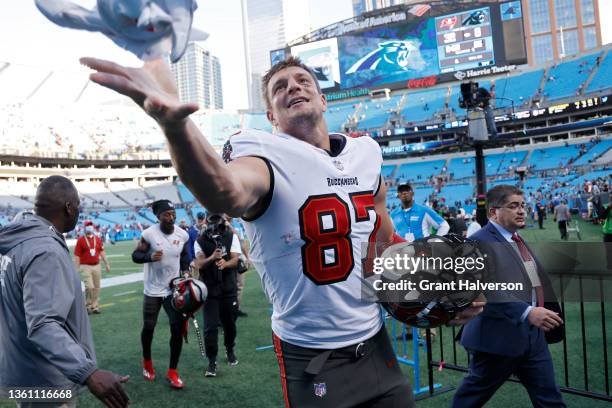 Rob Gronkowski of the Tampa Bay Buccaneers runs off the field after a win over the Carolina Panthers at Bank of America Stadium on December 26, 2021...