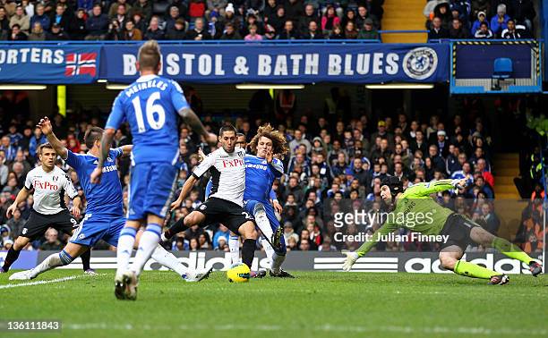 Clint Dempsey of Fulham scores a goal to level the scores at 1-1 despites the attentions of David Luiz and Petr Cech of Chelsea during the Barclays...