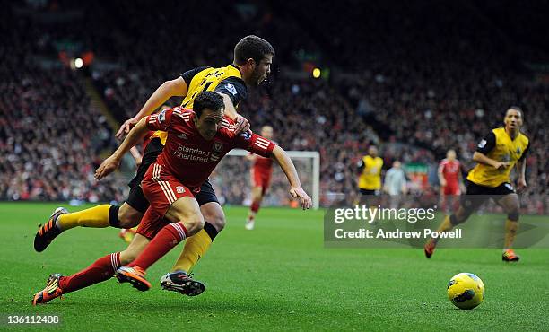 Grant Hanley of Blackburn tussles with Stewart Downing of Liverpool during the Barclays Premier League match between Liverpool and Blackburn Rovers...