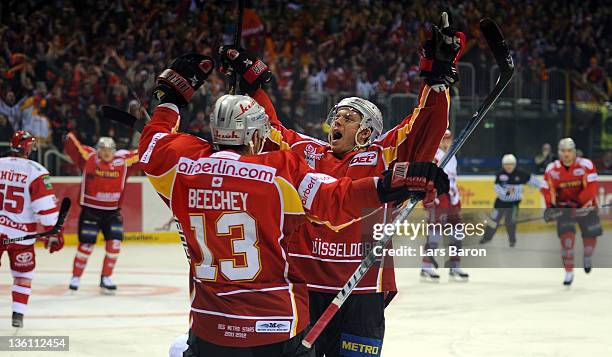 Jeff Ulmer of Duesseldorf celebrates after scoring his teams first goal during the DEL match between DEG Metro Stars and Koelner Haie at ISS Dome on...