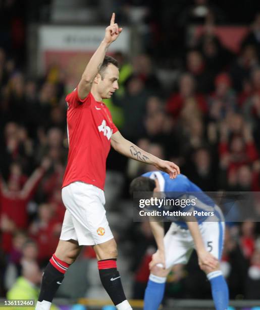 Dimitar Berbatov of Manchester United celebrates scoring their third goal during the Barclays Premier League match between Manchester United and...