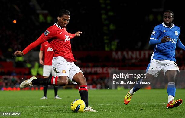 Antonio Valencia of Manchester United scores his team's fourth goal during the Barclays Premier League match between Manchester United and Wigan...