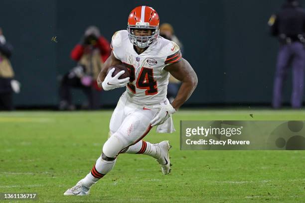 Nick Chubb of the Cleveland Browns runs for yards during a game against the Green Bay Packers at Lambeau Field on December 25, 2021 in Green Bay,...