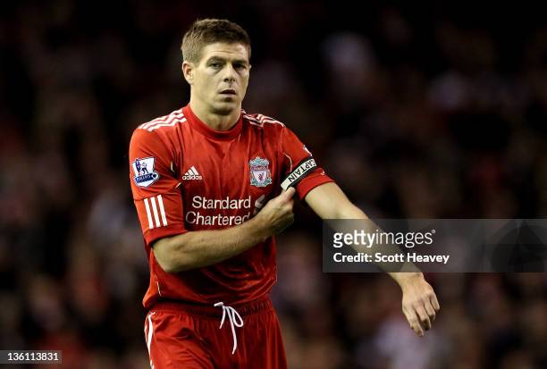 Steven Gerrard of Liverpool puts on the captain's armband during the Barclays Premier League match between Liverpool and Blackburn Rovers at Anfield...