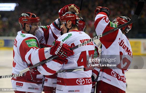 Alexander Weiss of Koeln celebrates after scoring his teams third goal during the DEL match between DEG Metro Stars and Koelner Haie at ISS Dome on...