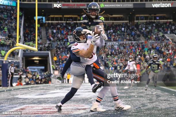 Jimmy Graham of the Chicago Bears catches the ball over Ryan Neal and John Reid of the Seattle Seahawks to bring Chicago within one point during the...