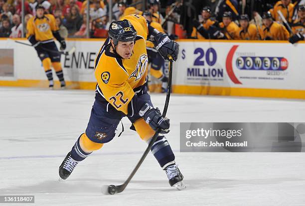 Jordin Tootoo of the Nashville Predators fires a shot against the Detroit Red Wings during an NHL game at the Bridgestone Arena on December 26, 2011...