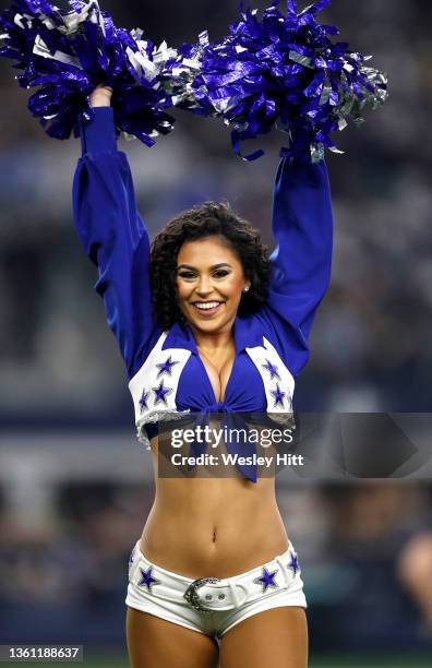 Dallas Cowboys Cheerleader performs during the game between the Washington Football Team and Dallas Cowboys at AT&T Stadium on December 26, 2021 in...