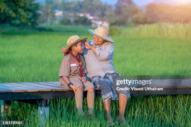 boy scout with mom in the scout camp activity. - wildlife reserve stock pictures, royalty-free photos & images