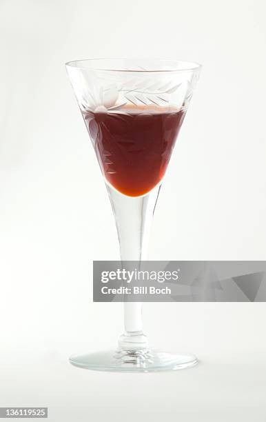 glass of port wine on white background - portwein stock-fotos und bilder