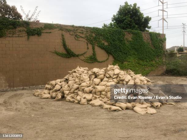 sand bags - flood preparation stock pictures, royalty-free photos & images