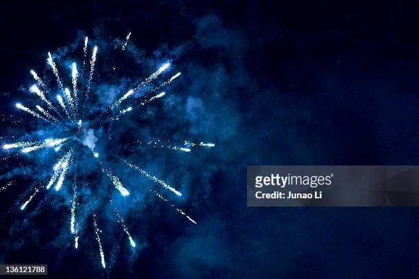 blue firework - firework display stock pictures, royalty-free photos & images