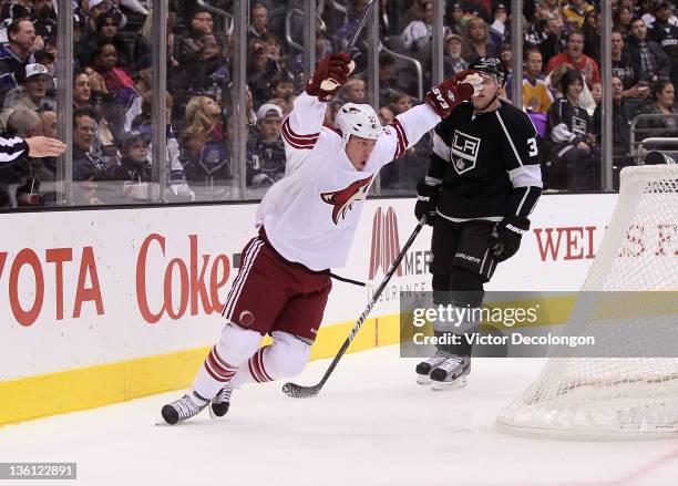 Raffi Torres of the Phoenix Coyotes celebrates his first period goal as Jack Johnson of the Los Angeles Kings looks on during the NHL game at Staples...