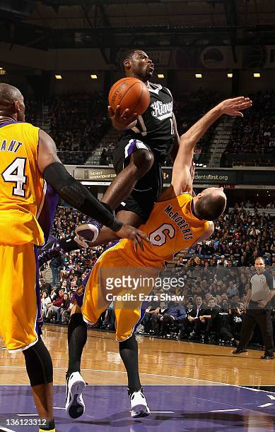 Tyreke Evans of the Sacramento Kings drives on Josh McRoberts of the Los Angeles Lakers at Power Balance Pavilion on December 26, 2011 in Sacramento,...