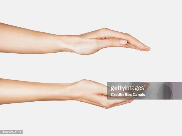 two hands - surrounding stock pictures, royalty-free photos & images