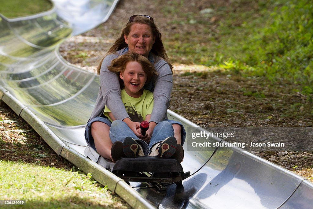 Mother and daughter on slide