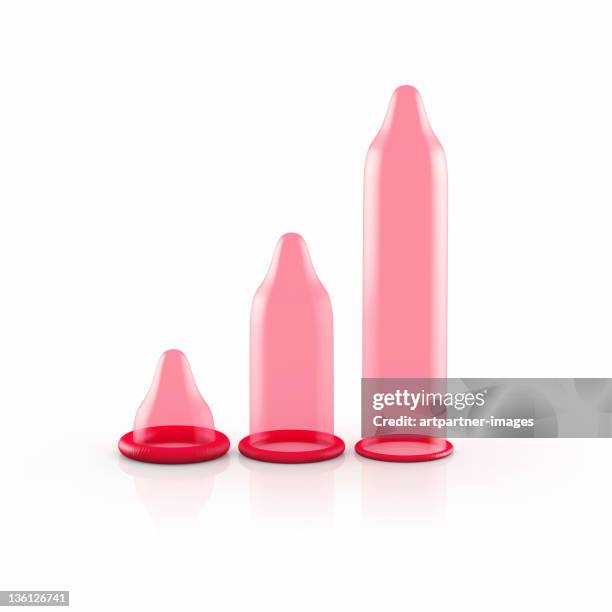3 red condoms of different size or length - kondome stock-fotos und bilder