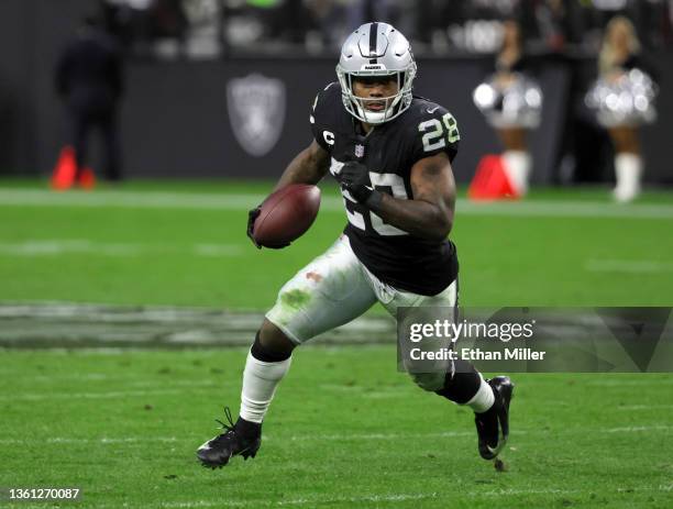 Running back Josh Jacobs of the Las Vegas Raiders carries the ball against the Denver Broncos during their game at Allegiant Stadium on December 26,...