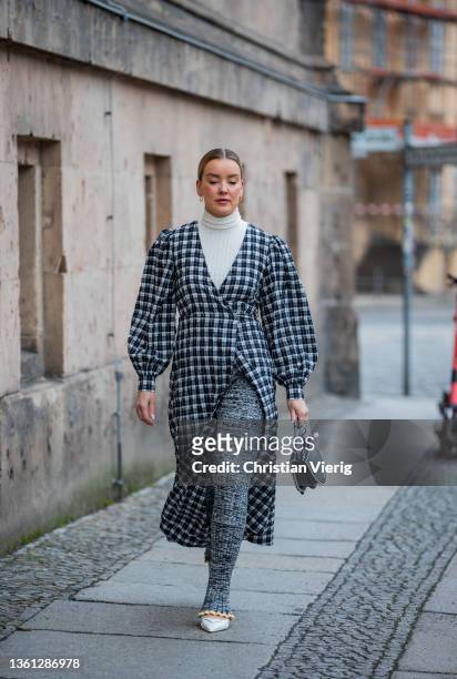 Tina Haase is seen wearing Ganni checkered dress, Gina Tricot x Hobnob Journal knitted flare pants, Prada slingback pumps, Karl Lagerfeld bag on...