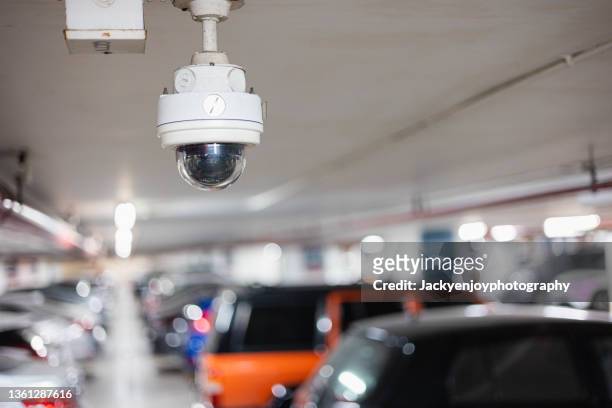 a surveillance/security camera setting at the parking lot in shopping mall or office. - övervakningskamera bildbanksfoton och bilder