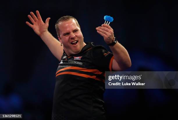 Dirk van Duijvenbode of Netherlands in action during his Round Three match against Ross Smith of England during Day Ten of the William Hill World...