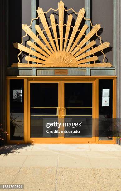 wisconsin gas building (1930) - art deco entrance with bronze sunburst, milwaukee, wisconsin, usa - bronze alloy stock pictures, royalty-free photos & images